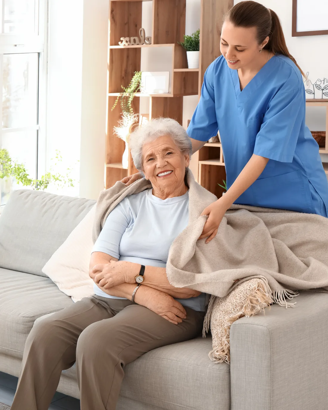 elder-on-couch-with-nurse
