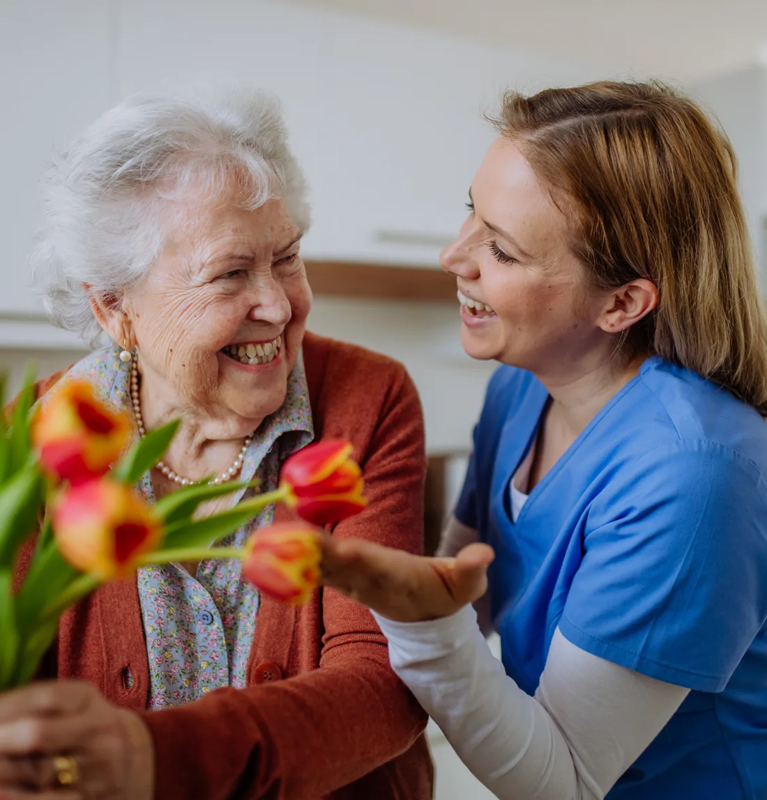 happy-senior-woman-with-flowers