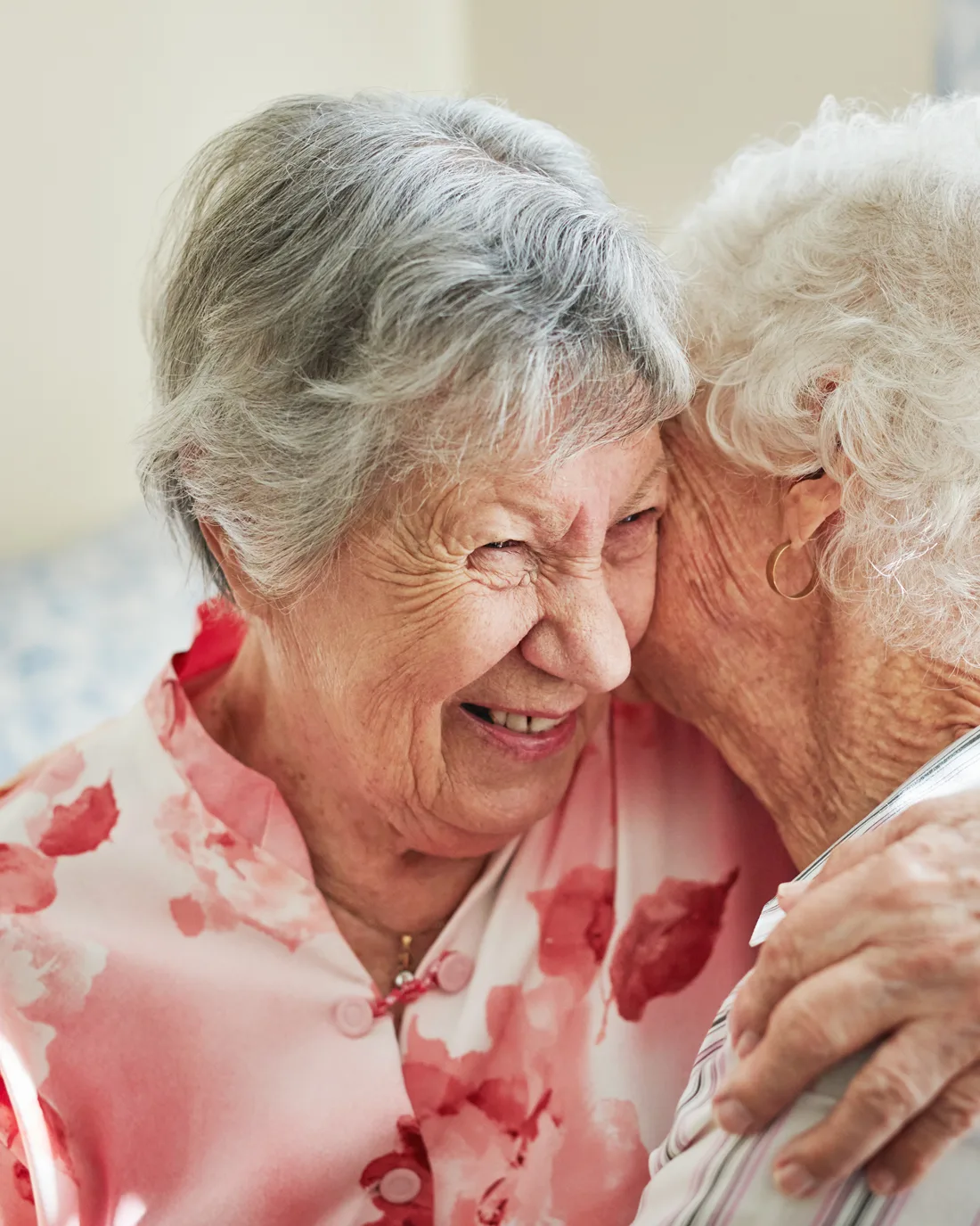 two-senior-women-laughing-and-hugging