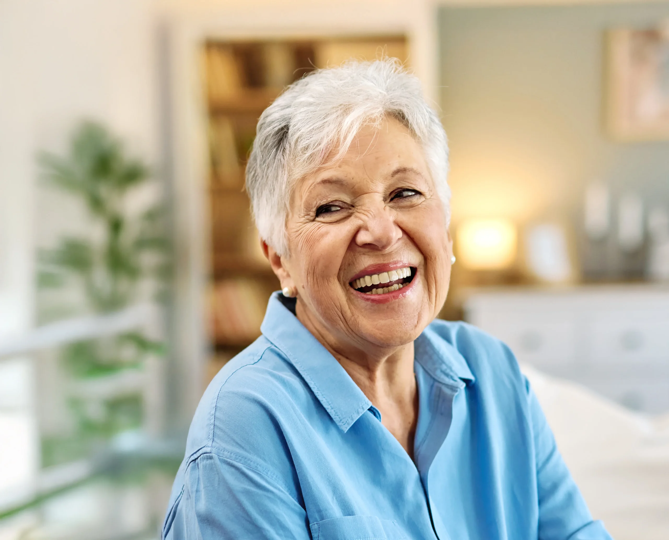 senior-smiling An older adult female smiling and laughing in her home